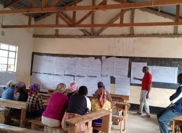 With the community in a focus group discussion for the Uraia governance project